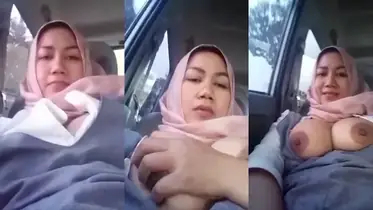 Bokep Jilbab Tante Pamer Toket Gede di Mobil Basah